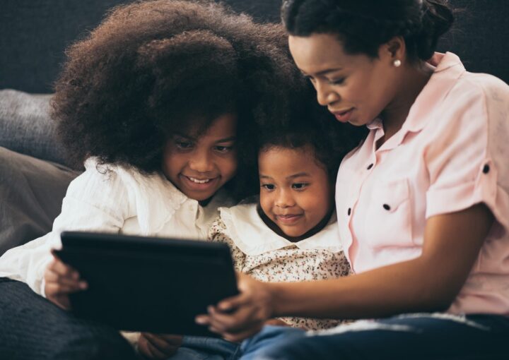 african american family at home, mom and children