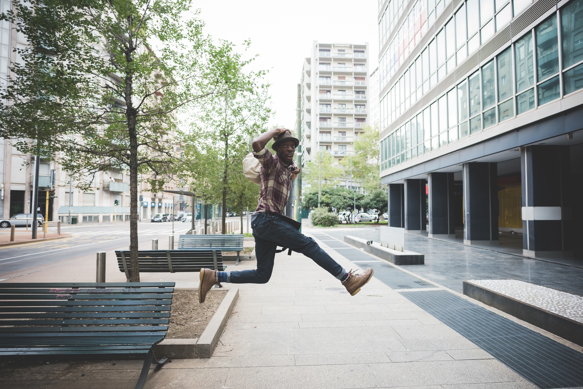 young black man jumping outdoor